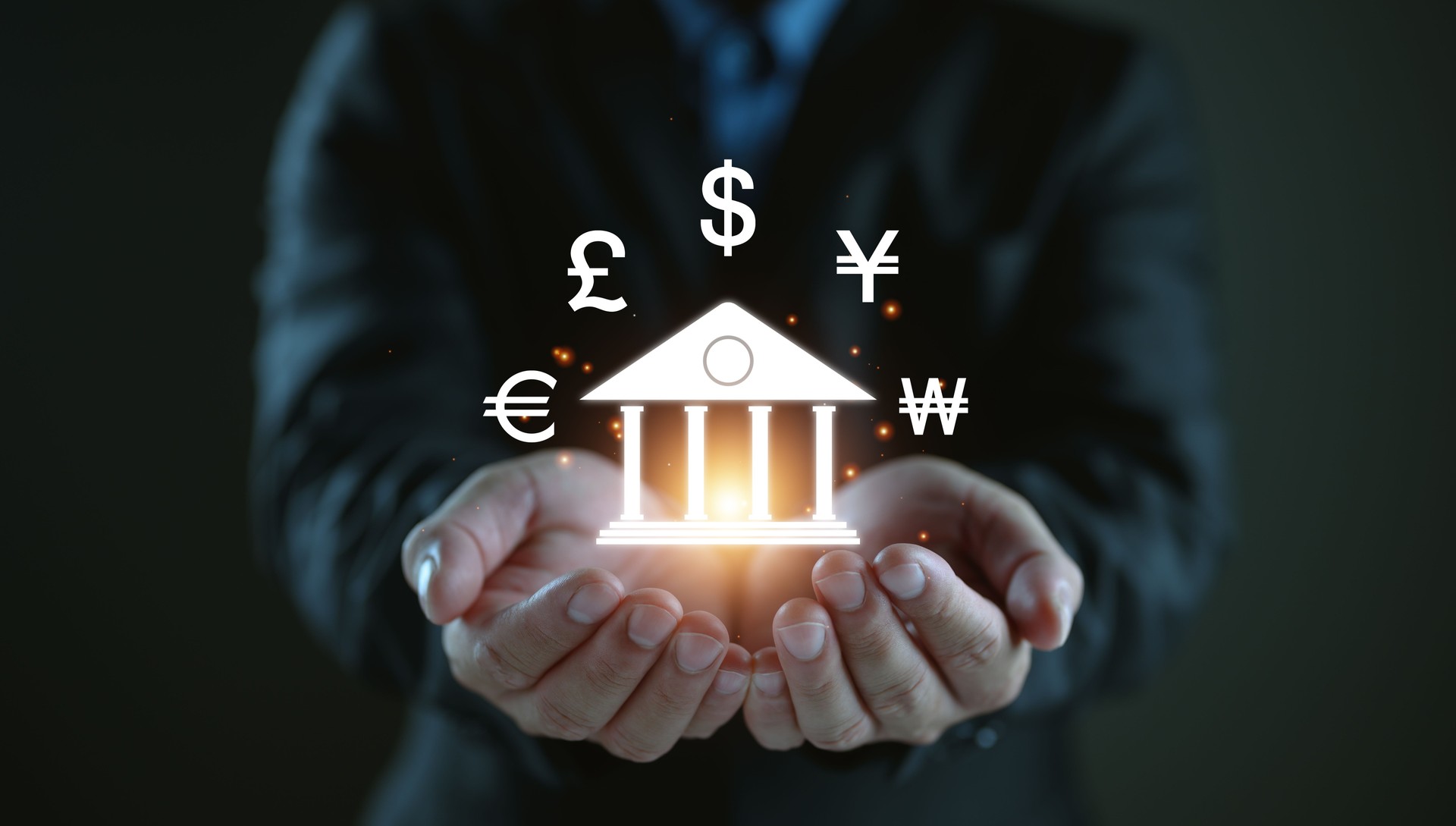 Businessman show central banking and international currency include dollar Yuan Yen Pound sterling and Euro for forex and currency exchange money transfer concept. Business finance and technology.